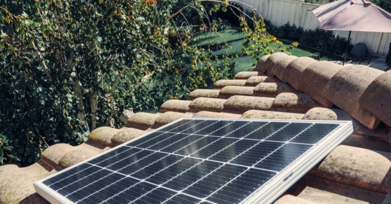 close up of a solar panel installed on a tiled roof capturing clean energy